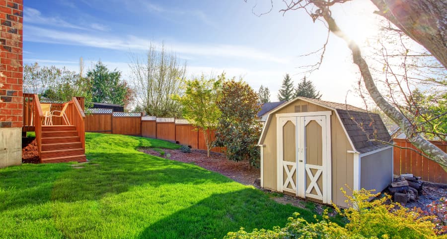 Fenced backyard with storage shed in Lexington